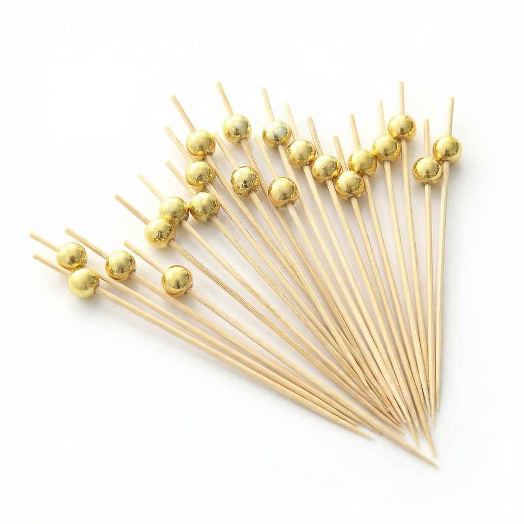 Brocheta de bambú con perla