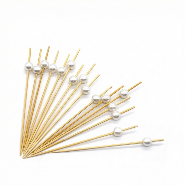 Brocheta de bambú con perla
